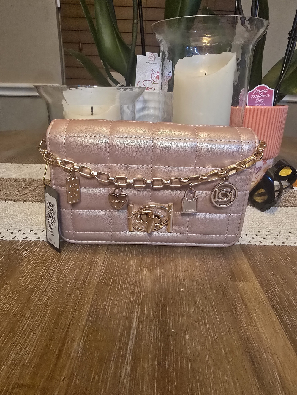 bebe Jacari crossbody handbag in pink iridescent mauve